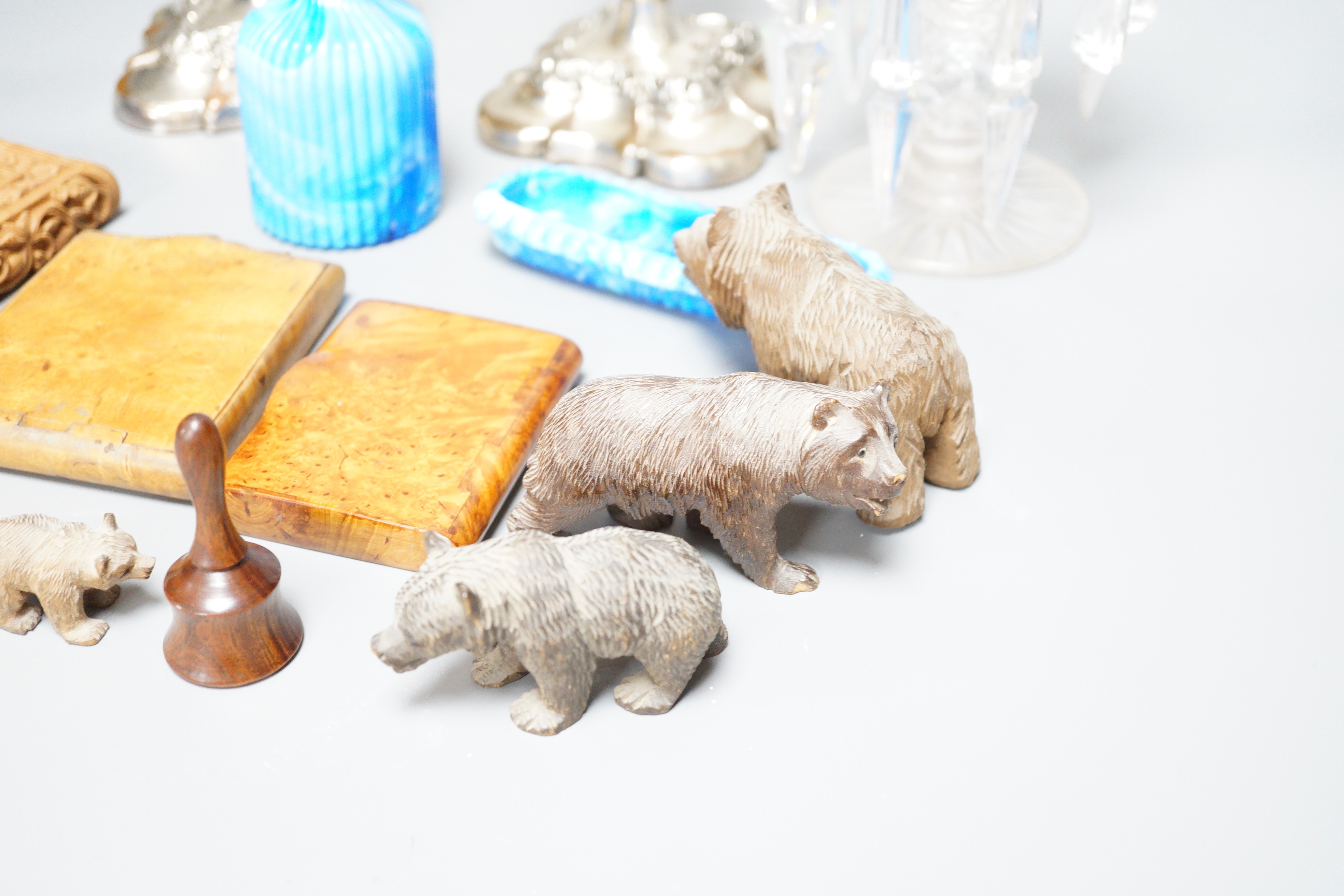 Four Black Forest carved wood bears, a Victorian glass table lustre, two coloured slag glass items, etc.